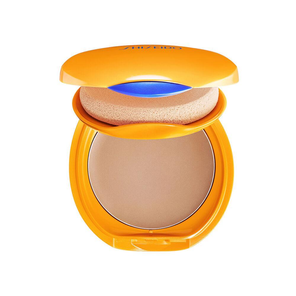 shiseido shiseido sun f.t.comp.br.f10 12g - foto 1 Cipria compatta Shiseido Sun con confezione gialla dorata, prodotto aperto che mostra polvere beige e spugnino